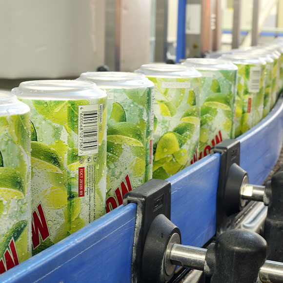 Cans on conveyor belt drinks factory